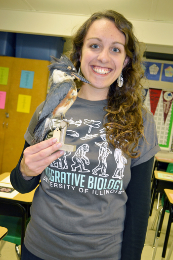 Illinois ornithologist displays one of the stuffed birds she brought for her "Birds of a Feather" display.