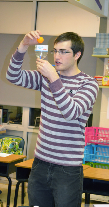 Illinois grad student prepares to illustrate the Bournoulli principal in the physics exhibit, "May the Force Be With You.