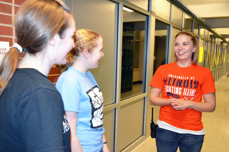 Chancellor's Public Engagement Fellow Julia Ossler (right) chats with other Illinois students during the Science Night at Danville's South View Middle School.