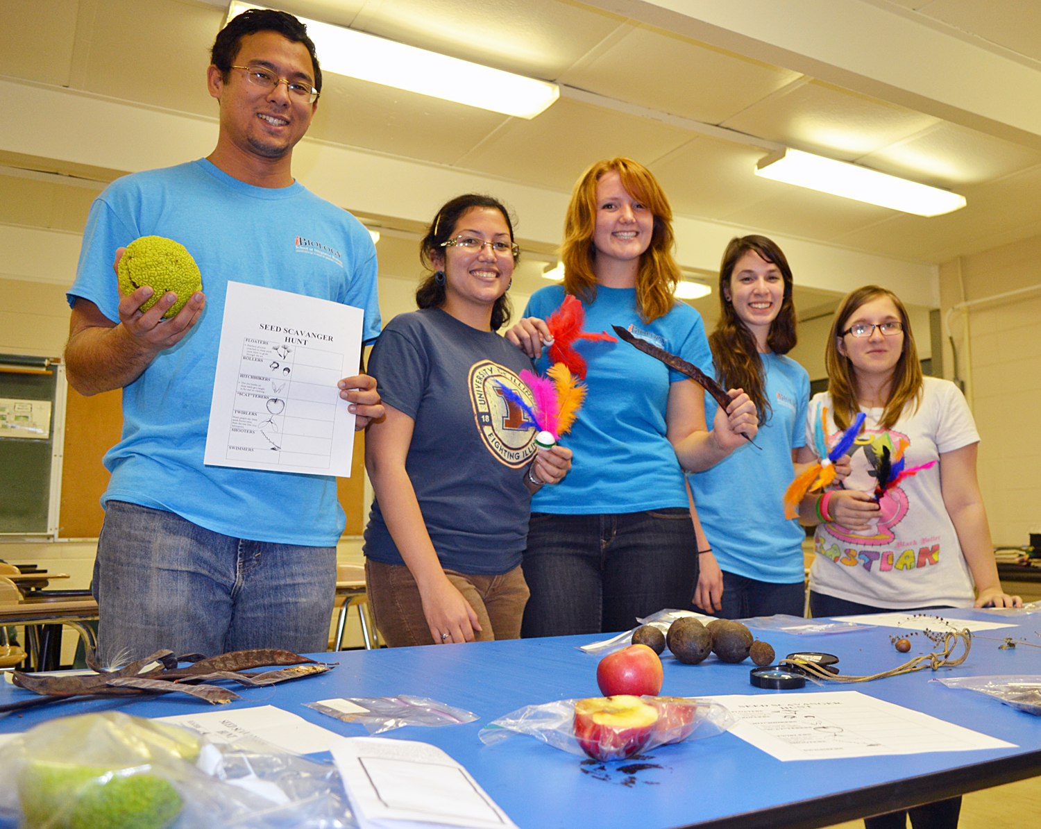 Illinois students in charge of the "We Like to Move It, Move It" shows some of the exhibits they used to explain how "plants fool humans and animals int spreading their seeds all over the planet!"