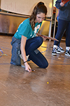 During Sonia Math Day, a participant writes down data as they participate in the 