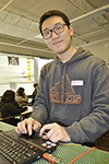 Centennial High senior, Edward Lu, getting the laptops set up to display the laser light shows.