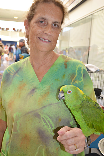 Laura Peyton holds Cracker Jack the parrot.