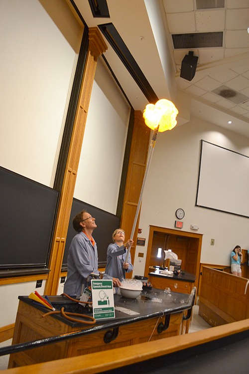 Don DeCoste and Gretchen Adams ignite a gas-filled bubble during the  chemistry demo.