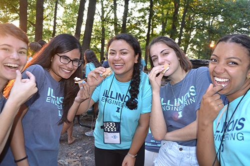 A group of freshmen and mentors enjoy s'mores (and faux s'mores).