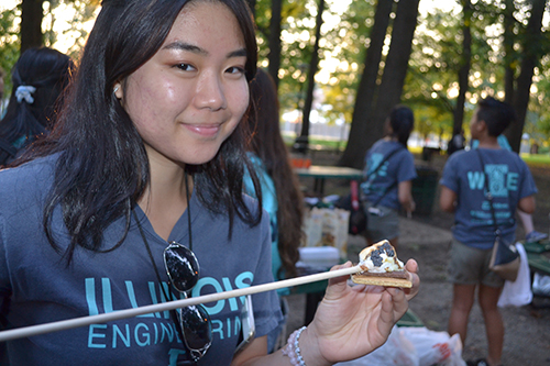 Above: A freshman prepares to enjoy the s'more she just made at Wednesday night's bonfire.