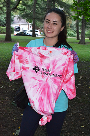 A mentor shows off her tie-dyed Texas Instruments t-shirt. 