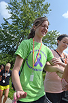 During the Faith Walk exercise, the WIE camper who must keep her eyes shut is led across a bridge by her partner who cannot speak to give her instructions.