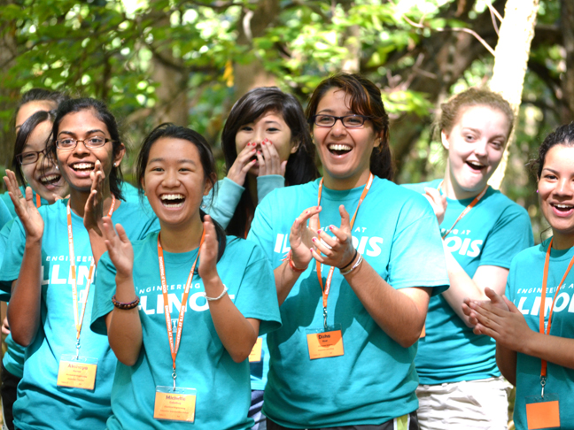 WIE campers cheer on a teammate during the Freshman Orientation Camp.