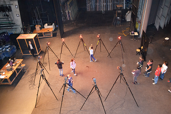 Wiley 5th graders experiment with motion capture technology on a stage at the Krannert Center.