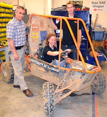 Mike Philpott with students Katherine Birkel and Paul Hummon show off Baja's fresh coat of Illinois mud from this past weekend.