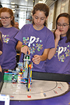 Members of the P cubed team work on their lego robot at the FIRST Lego Champtionship.