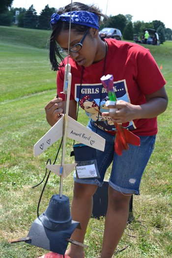Aerospace Engineering G.A.M.E.S. camper prepares her glider for launch.