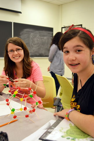 Campers build a model of an organic molecule during one of the camp's sessions.
