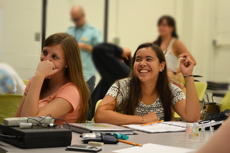 Two participants in Environmental Engineering G.A.M.E.S. camp enjoy a session about water purity