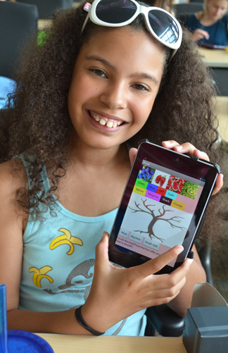 GEMS camper proudly displays the Android app she created.