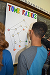 An Edison Middle School eighth grader places one of his pieces down while playing Tomb Raiders.