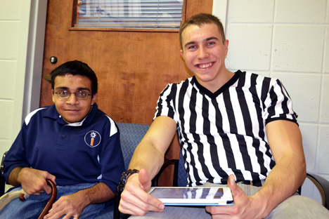 iRobotics Outreach Coordiator Arsalam Aslaam (left), and fellow iRobtoics member, who served as a judge during the recent practice competition in November.