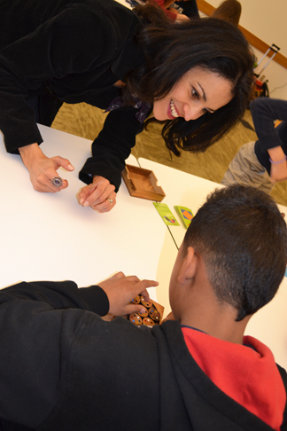 Rochelle Gutiérrez interacts with middle school student at the Noyce iMath club.