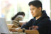 image of male student using laptop