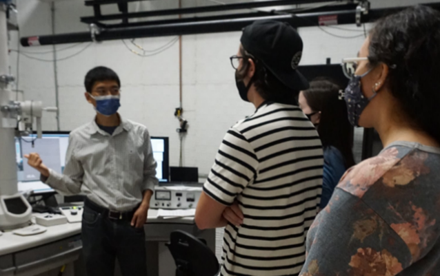 I-MRSEC REU Dr. C.Q. Chen shows REU participants one of the MRL’s transmission electron microscopes.