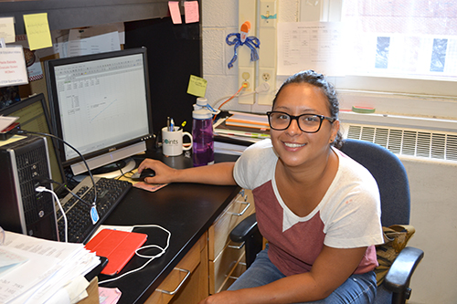 Paola Estrada at her desk in the Nair Laboratory