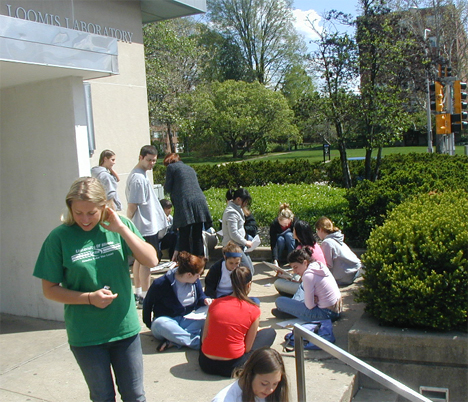Original class of Physics 123 students gather outside Loomis Lab for an activity.