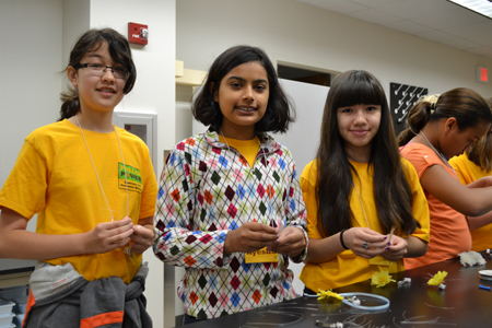 Campers working on their fiber optic barettes.