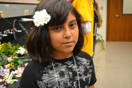 Camper wears the flower she made for her hair.