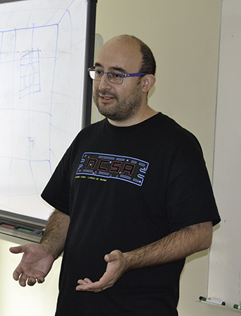 Dr. Eliu Herta gives a brief presentation during  SPIN's Lightning Talks.