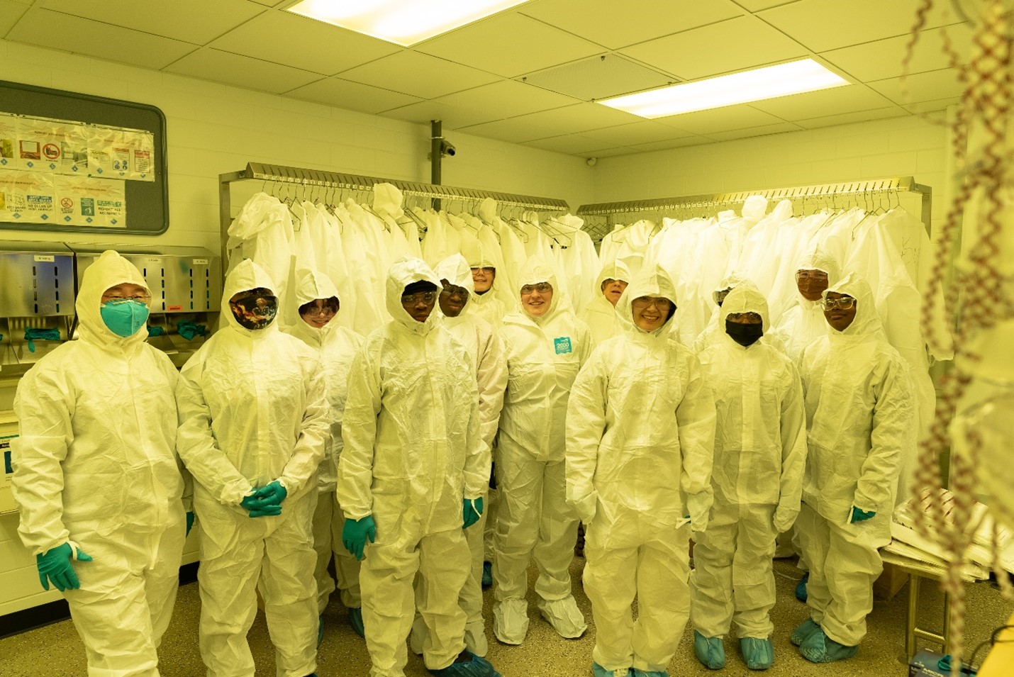 MRL staff scientist Dr. Xiaoli Wang and a group of Franklin STEAM Academy students and leaders suited up before going on a tour of the MRL cleanroom in February (2023).