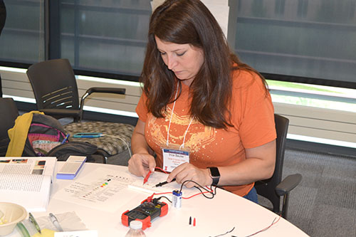 Sarah E. Goode STEM Academy’s arts instructor, Irica Baurer, tests her circuit.