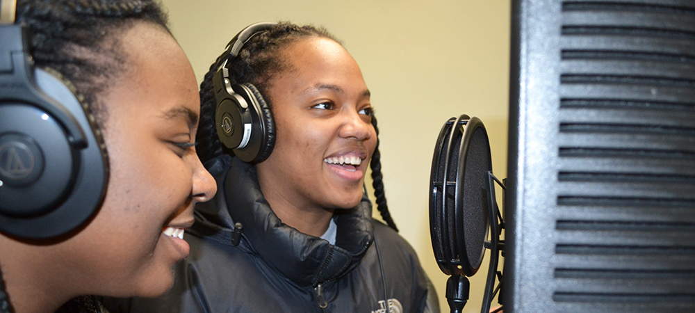 Two Franklin STEAM Academy eighth graders record the rap they wrote about magnetism as part of the NSF-funded I-MRSEC's Musical Magnetism curriculum.