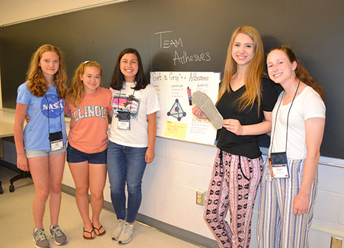 Team Adhesives shows their prototype and the poster they presented at the GLAM poster session.