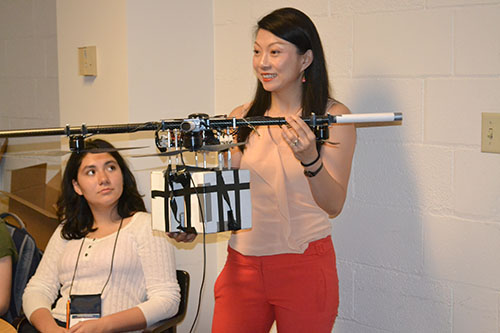 Computer Science and Aerospace Engineering Assistant Professor Grace Gao exposes the GLEE campers to some aeronautical engineering principles.