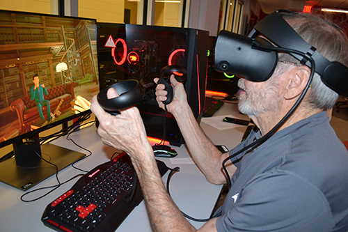 A French 205 student chats with a fellow student during one of the VR sessions.