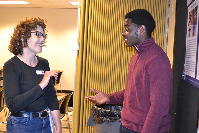 Darius Jackson chats with a member of the Champaign School Board.