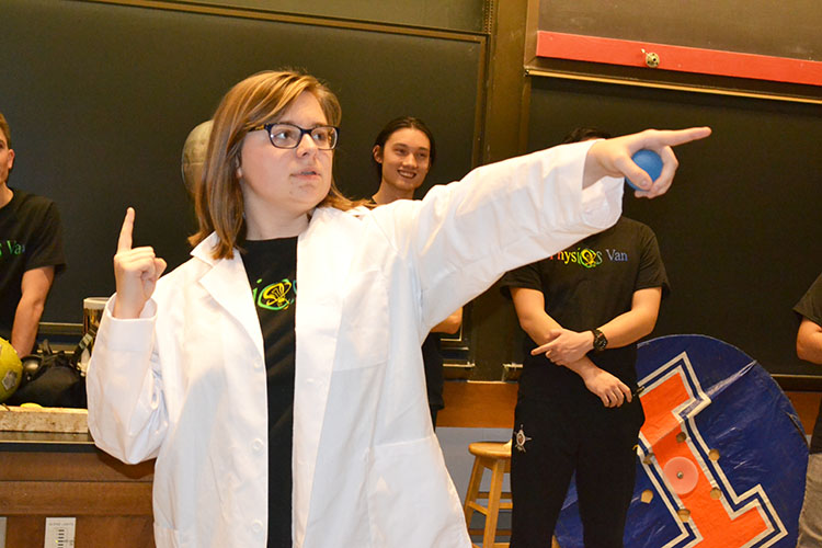 Spencer Hulsey calls on a young student who's volunteering to participate in a demo during a recent Physics Van show.