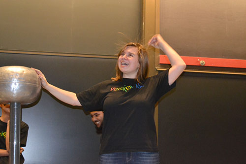 Spencer Hulsey demonstrates how the Van de Graaff Generator can cause one's hair to stand on end