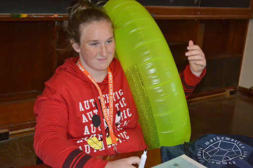 Maggie Booth-Hodges plays with a Torus. 