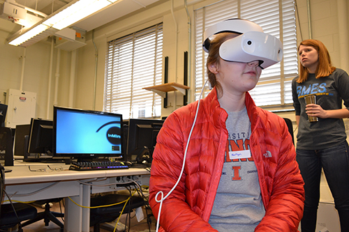 At SWE's spring 2018 Introduce-a-Girl-to-Engineering Day, a high school student experiences the human brain during BMES's virutal reality session.