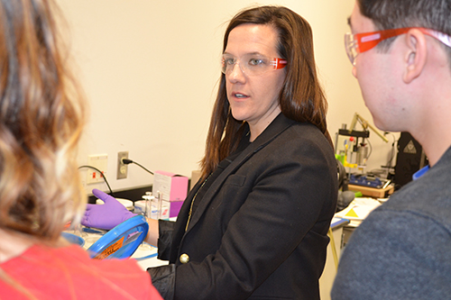 Holly Golecki (center) explains to two of her students the benefits of certain kinds of silicone.