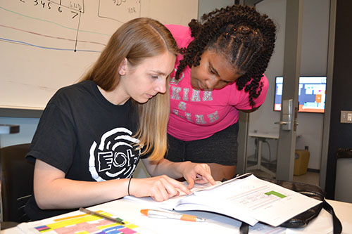 Maddie Wilson (left) does a quality check on Cheyenne McClinton's  LED calculator.