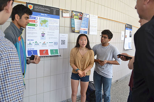 Uni High students present their poster.
