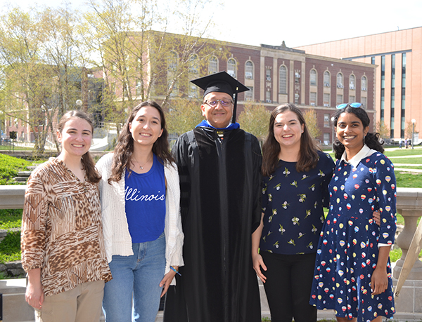 The four Engineering seniors,   Courtney Leverenz, Berat Gulecyuz, Eugenia Maldonado, and Shivani Ganesh get a photo op with Engineering's Dean Rashid Bashir (center) on the portico overlooking Engineering Quad. 