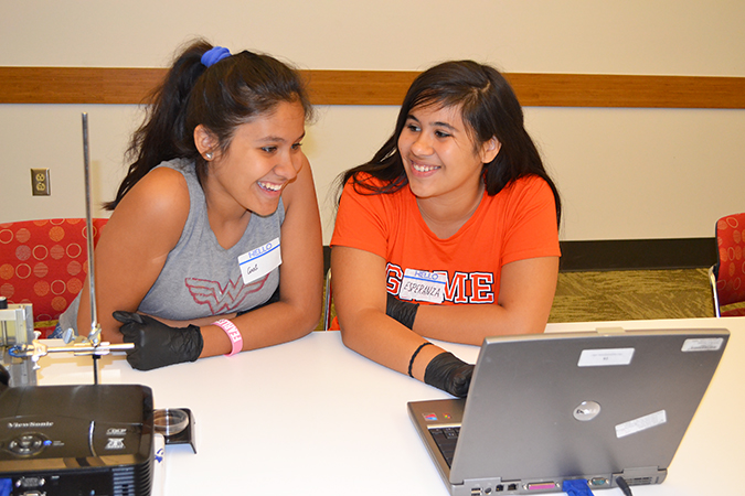 The two sisters discuss which object to print.