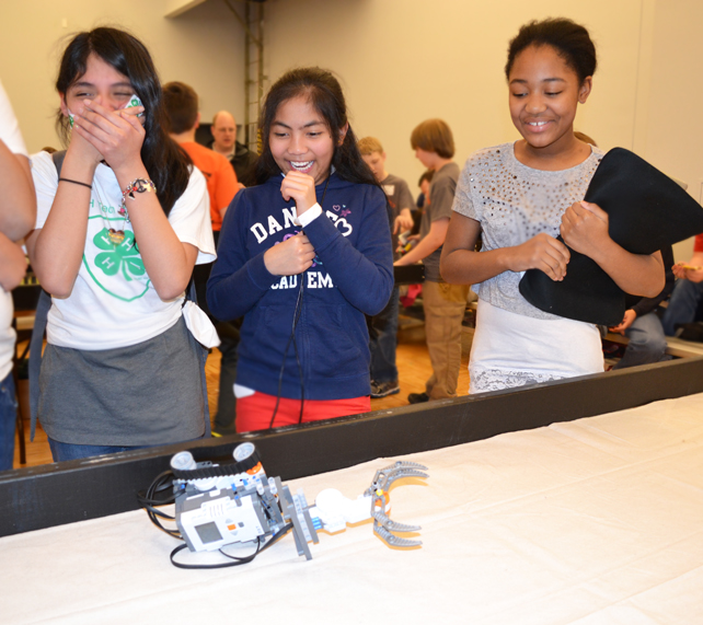 Members of a robotics team enjoy the competion