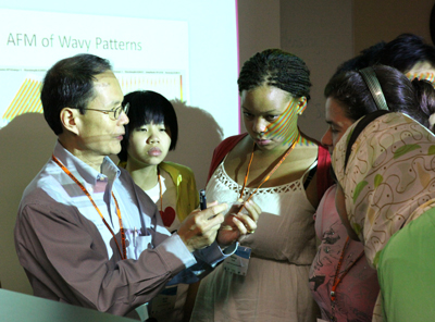 Lecturer gives participants a chance to examine  something close-up during a module.