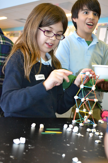 Students build a tower taller prior to giving it the Jello earthquake shake test.