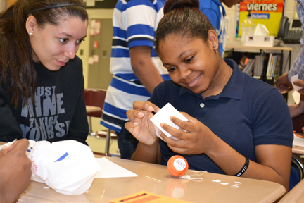 Two contestants work on their design for the Battle Chip challenge.